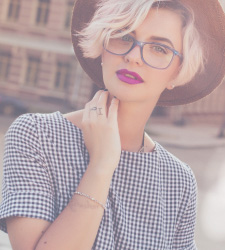 young woman in glasses and hat